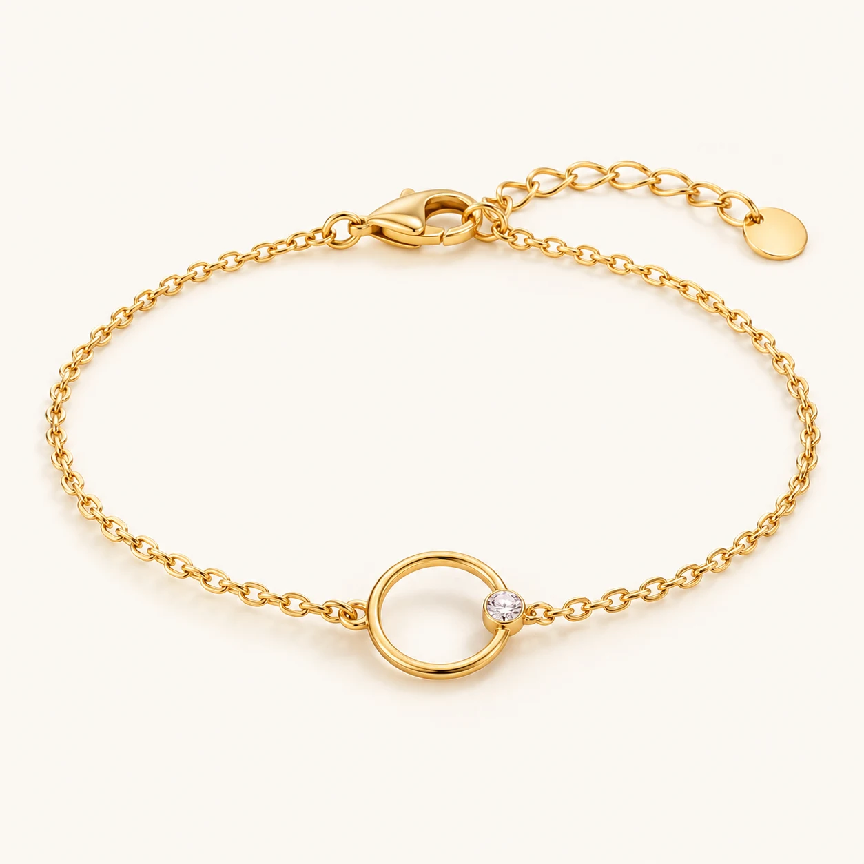 Golden Orbit in Gold, fine chain bracelet, single open circular ring center with one tiny round clear cubic zirconia on the ring, lobster clasp and extender