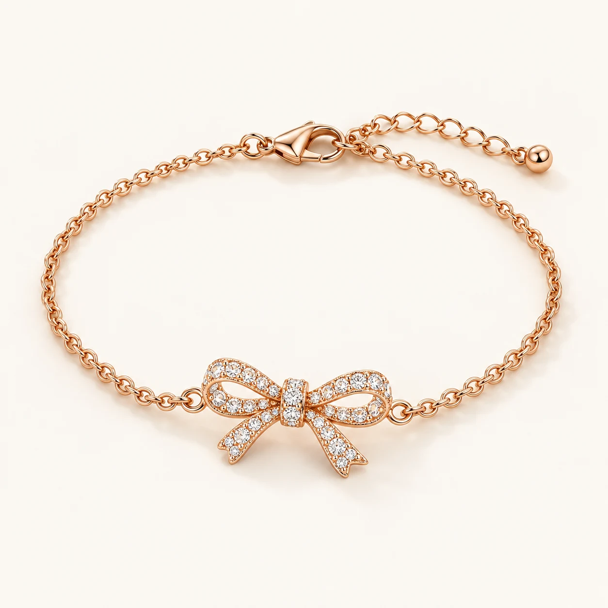 Ribbon Gleam in Rose Gold, fine chain bracelet with one bow-shaped centerpiece pave set with clear cubic zirconia, lobster clasp and extender