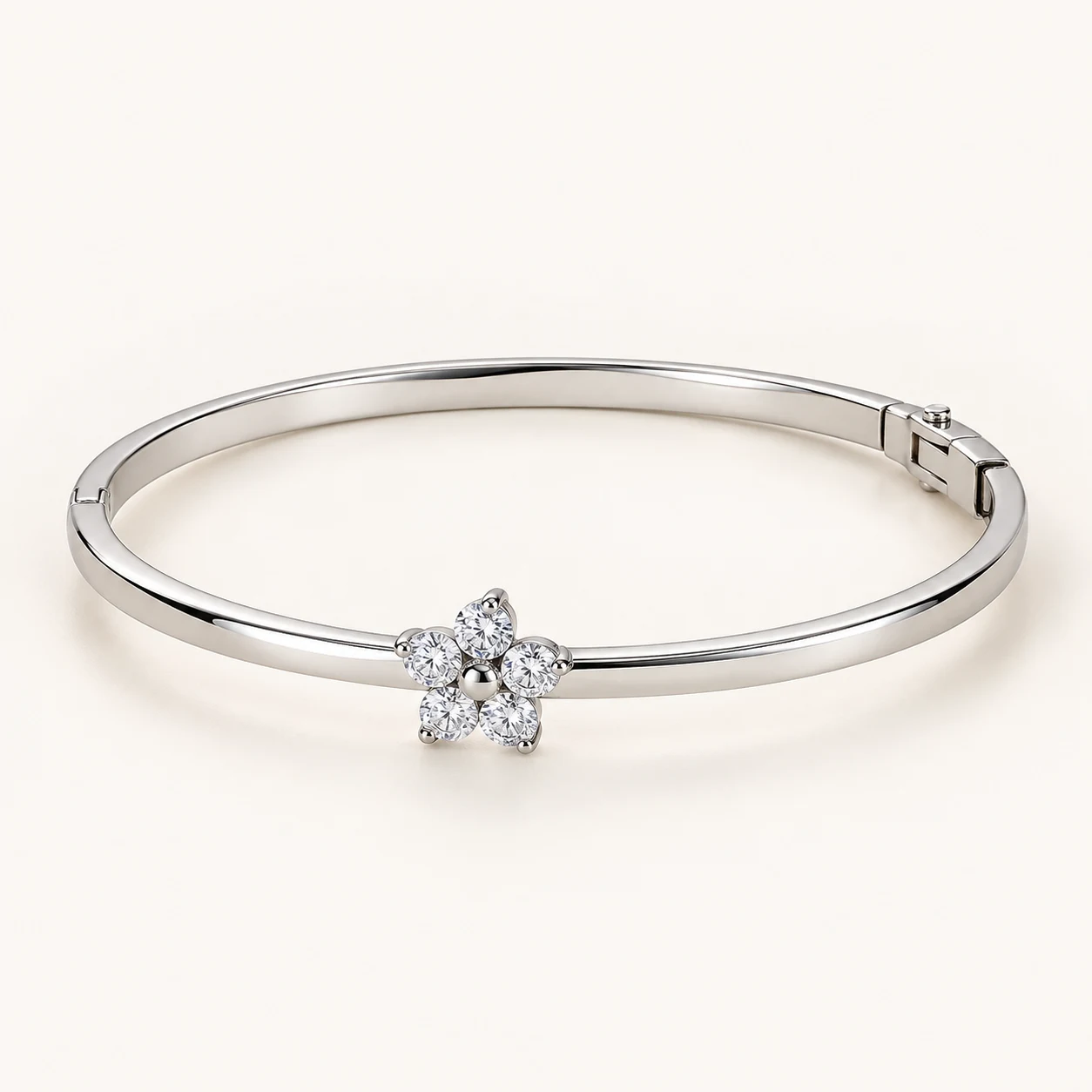 Vesper Bloom in Silver, slim hinged oval bangle, one central cluster flower of five clear round cubic zirconia petals, otherwise plain metal band