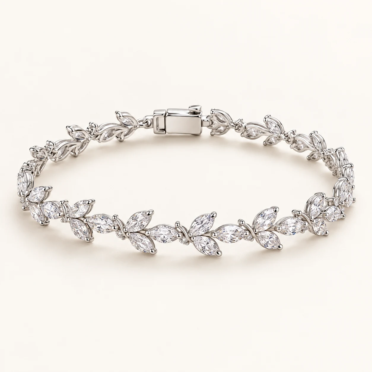 Aveline Marquise in Silver, articulated bracelet with clear marquise cubic zirconia forming delicate alternating leaf sprigs along the front, box clasp
